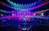 This photograph captures our 20 connecting, modular, scanning lasers and 12 full colour all OPSL lasers creating a display of multi-coloured light highlighting the 40-foot robot sculpture, by Japanese artist Hajime Sorayama.