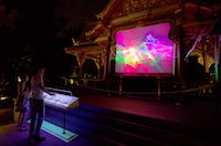 Lasing Nang Talung was a laser lumia-based interactive kinetic art installation that was shown in the Thai Pavilion of the Olbrich Botanical Gardens in Madison Wisconsin. This shows the theremin controllers in use, allowing the audience to change the speed and brightness of the display. The pavilion is made of teak coated with gold leaf, a gift of the King of Thailand. My installation was designed to fit into the front portico.